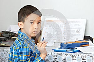 Boy is doing his homework
