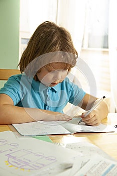 Boy is doing his homework at home during a pandemic