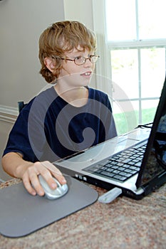 Boy doing homework on computer