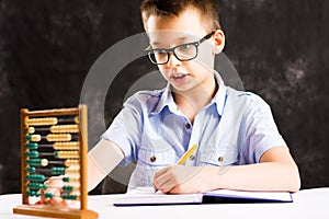 Boy doing math homework at home