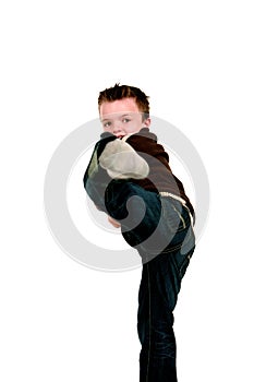Boy doing karate kick
