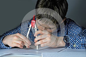 Boy doing maths school homework