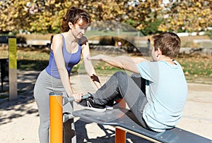 Boy doing push-ups on sport bench