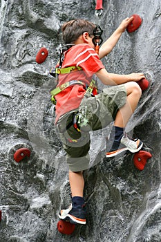 Boy doing rockclimbing