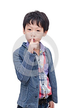 Boy doing a sign plese stop talking