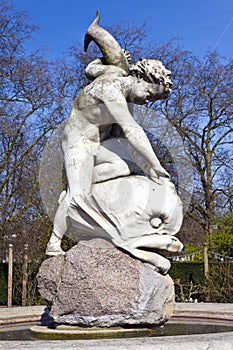 Boy with Dolphin Sculpture in Hyde Park.