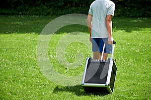 Boy dragging a music box