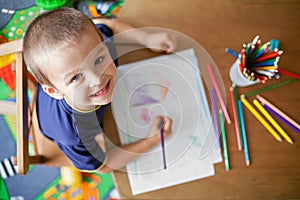 Boy, drawing a picture for fathers day