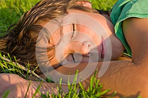 Boy dreaming on grass