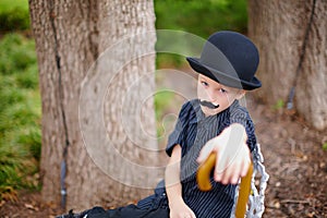 Boy dressed as Charlie Chaplin photo