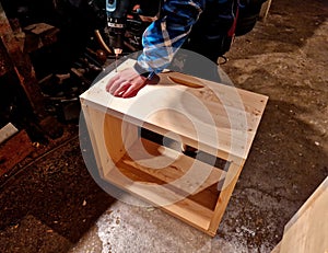 boy drills holes in a beehive. construction activity is a teaching or