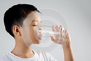 Boy drink water from glass