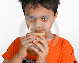 Boy drinking a glass of juice