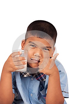 Boy drinking milk and concede