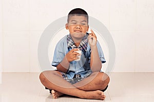 Boy drinking milk and concede