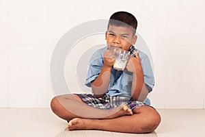 boy drinking milk and concede photo