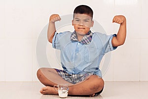 Boy drinking milk and concede photo