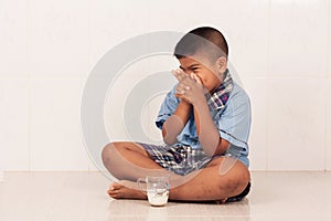 Boy drinking milk and concede photo