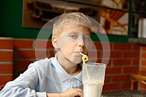 Boy drinking milkshake