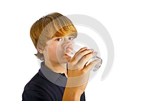 Boy drinking water out of a glass