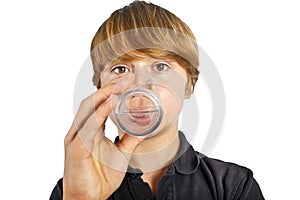 Boy drinking water out of a glass