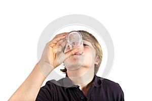 Boy drinking water out of a glass