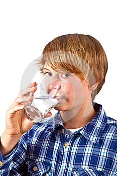 Boy drinking water out of a glass