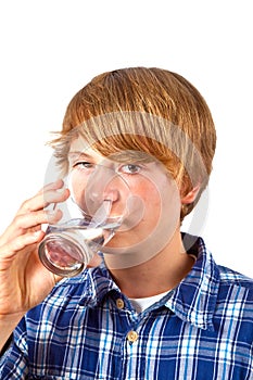 Boy drinking water out of a glass