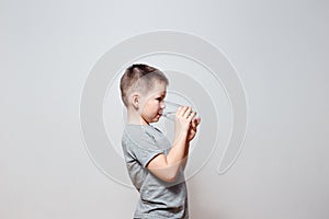 Boy drinking water from transparent glass