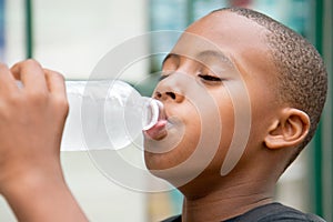 Boy drinks water