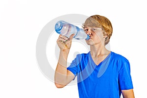 Boy drinks water out of a bottle