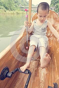 Boy driving boat