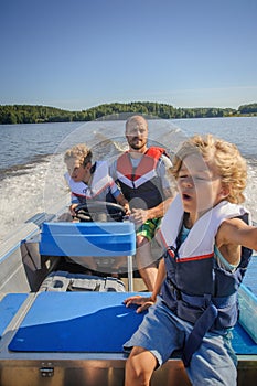 Boy driving boat