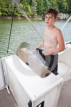 Boy Driving Boat