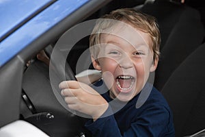 Boy driving a car