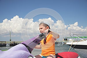 Boy driving water scooter