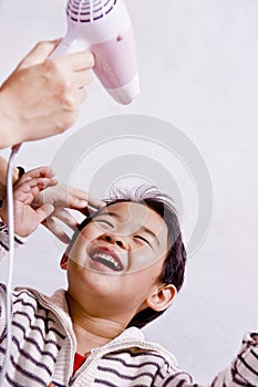 Boy drying hair