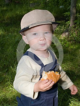 Boy eating roll
