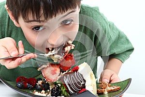 Boy Eating Cheesecake