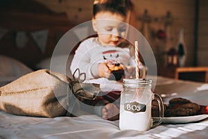 Boy eating cookies in bed