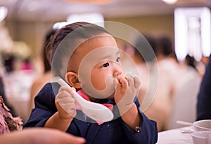 A boy is eating food.