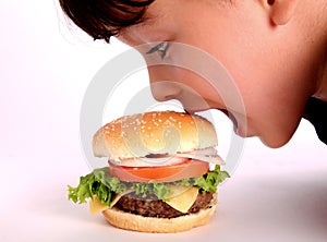 Boy eating hamburger