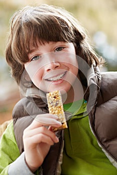 Boy Eating Healthy Snack Bar