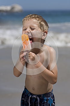 Boy eating ice lolly