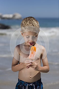 Boy eating an ice lolly