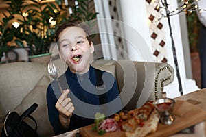 Boy eating lula kebab