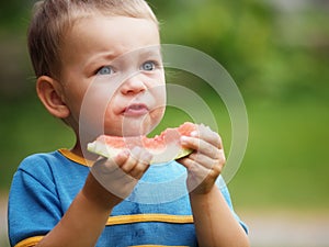 Boy eating melon