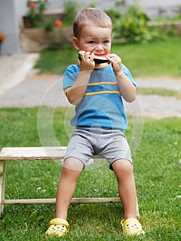 Boy eating melon