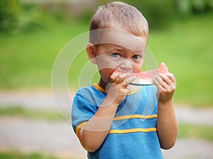 Boy eating melon