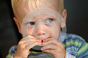 Boy eating melon